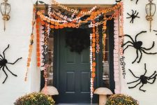 49 orange, black and white and pink paper Halloween banners with letters are a cool idea for a porch or a mantel