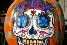 a colorful sugar skull Halloween pumpkin is a creative idea for those who don’t want to carve but have good painting skills