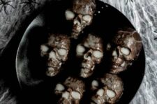 52 with a moist chocolate cake and simple glaze, these mini skull cakes are super spooky for any Halloween celebration
