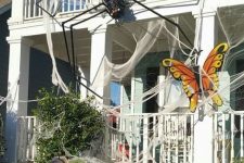 53 spiderweb, an oversized spider, a bold butterfly for styling a house for Halloween is a great idea to rock
