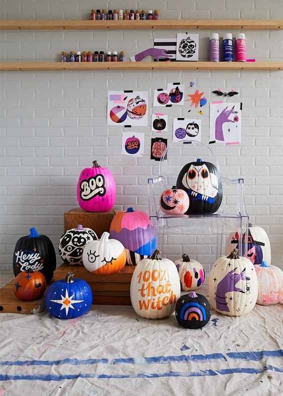 an arrangement of amazing colorful painted pumpkins in various bright colors is inspiring, make some for Halloween