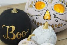 56 an arrangement of beautiful pumpkins – a matte black one, patterns ones and a gorgeous sugar skull styled pumpkin to finish off