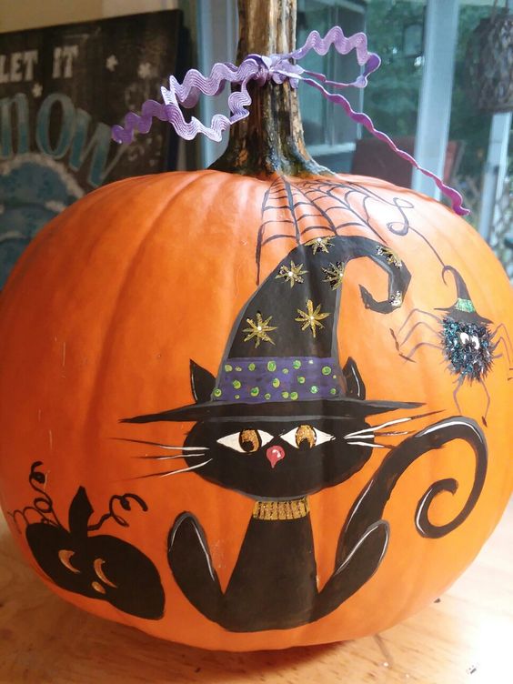 a beautiful painted black cat and spider pumpkin can be made even if you aren't that good at painting