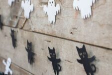60 simple Halloween paper garlands of skeletons, ghosts, black cats and bats are great to style your space for Halloween