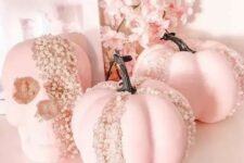 70 pink pumpkins and a skull decorated with pearls look adorable, chic and glam and will make your Halloween decor unforgettable