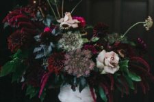 a Halloween flower arrangement of blush roses, burgundy dahlias, amaranthus, greenery and seed pods