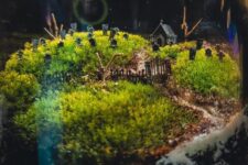 a beautiful and natural-looking cemetarium with moss, a graveyard is a refined and catchy Halloween decor idea