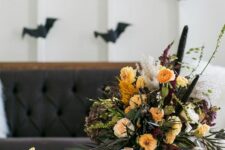 a bold Halloween flower arrangement of yellow, burgundy and blush flowers, some dried touches and foliage