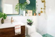a lovely bathroom with green accent wall