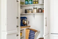 a cool small pantry with corner shelves, a built-in open storage unit, a stool and some cookware and appliances