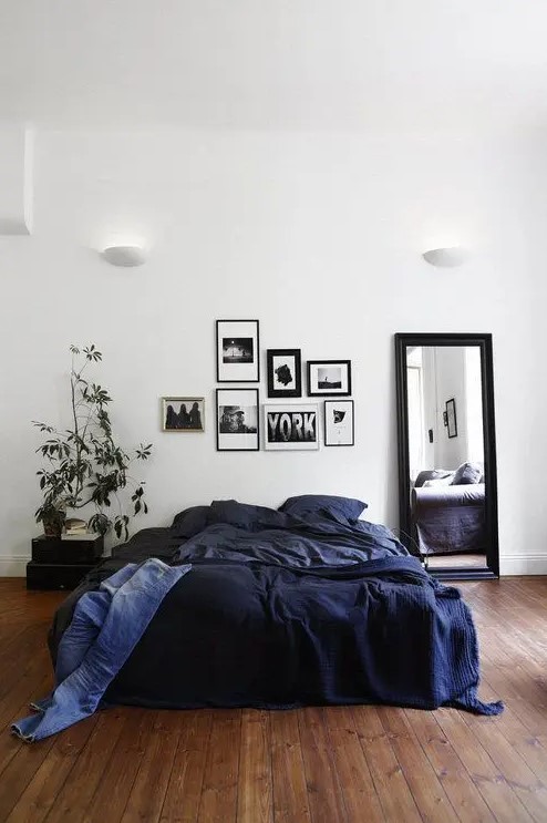 a gorgeous navy bedding set is a great and easy idea to add a masculine feel to the space