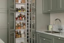 a small pantry perfectly blending with the kitchen, with built-in shelves and wine storage plus a small stool is a smart idea
