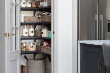 a small pantry with corner shelves, baskets and jars is a perfect addition to the kitchen, it looks neat and cool