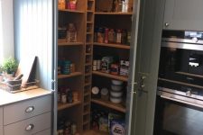 a small rustic pantry with built-in shelves and wine bottle storage, lights and food, drinks and other stuff