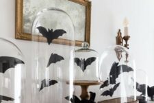 paper bats in cloches are nice and easy last-minute Halloween decoration, not only for a mantel