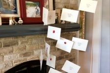 Harry Potter style fireplace decor with Hogwarts letters coming out of it is a super cool idea for a themed party
