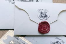a Hogwarts acceptance letter as a Halloween party invitation is a super cool and smart solution