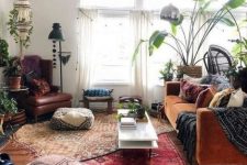 a cozy living room with a velvet sofa