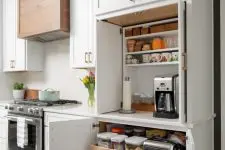 a built-in functional pantry with open shelves, appliances, jars with food is a cool idea to keep the clutter away