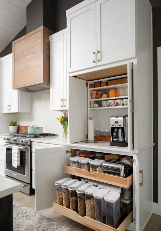 A built in functional pantry with open shelves, appliances, jars with food is a cool idea to keep the clutter away