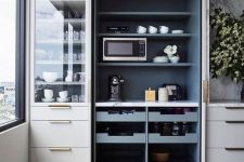 a built-in open pantry with open shelving, drawers, appliances, tableware and other stuff is a comfy unit