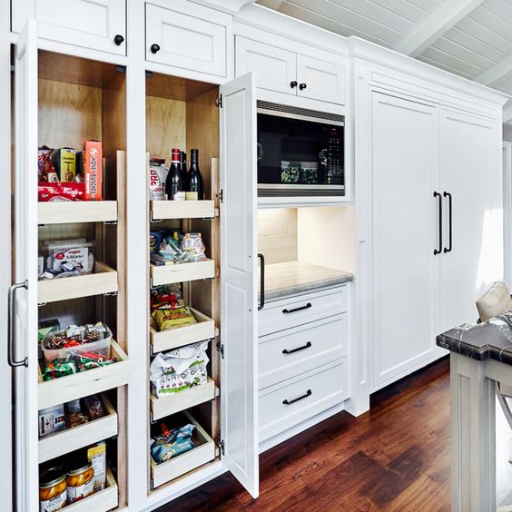 A built in pantry with drawers that let you store wine, food, canned food and spices is a smart idea for a kitchen