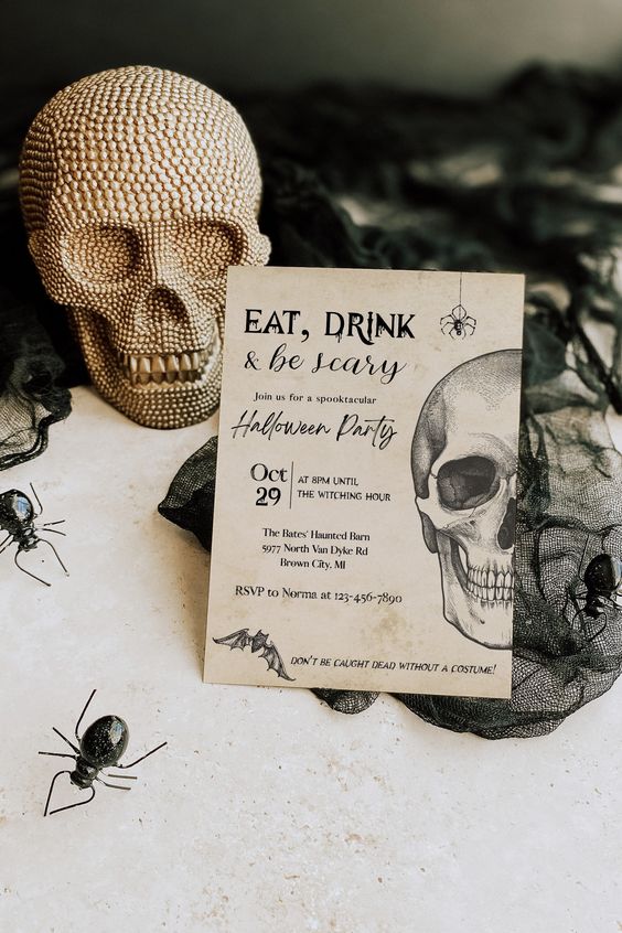 a classic graphic Halloween invitation with spiders, bats and a skull will never go out of style