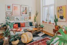 a colorful retro boho meets mid-century modern living room with folksy rugs and pillows, wicker touhes, potted cacti and succulents