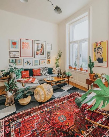 a colorful retro boho meets mid-century modern living room with folksy rugs and pillows, wicker touhes, potted cacti and succulents