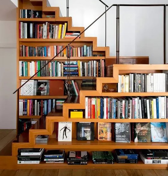 A creative staircase with bookshelves integrated right into it   a great space saving idea