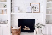 a farmhouse living room with a white brick clad fireplace to accent it and all neutrals around
