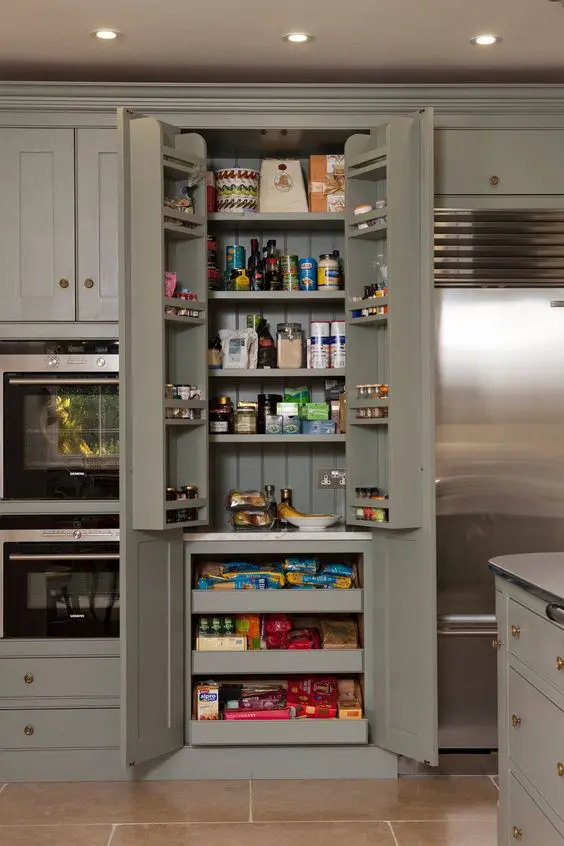 a grey-green kitchen with a built-in pantry, shelves, drawers and some shelves on the doors is a smart idea
