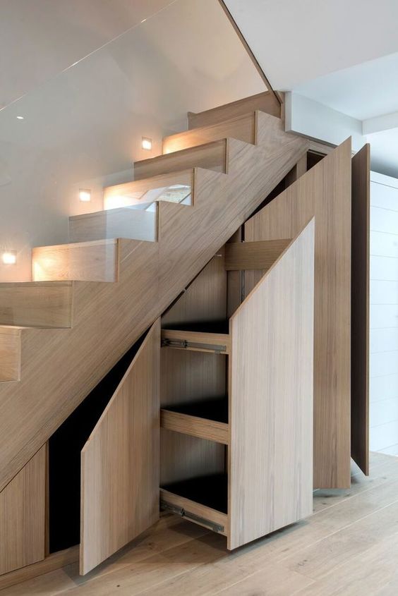 A light stained staircase with storage drawers and compartments is a cool idea for any modern home
