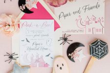 a lovely bright Halloween invitation suite with pink haunted houses and bats plus some calligraphy is a cool idea