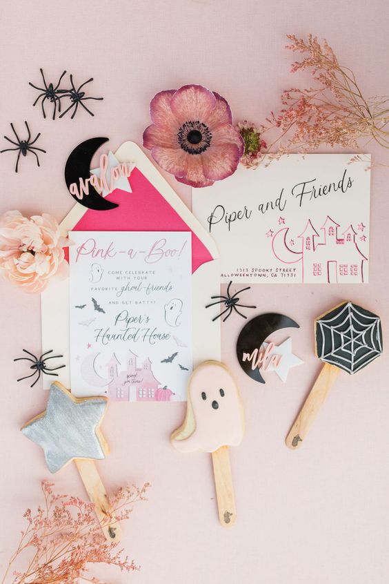 a lovely bright Halloween invitation suite with pink haunted houses and bats plus some calligraphy is a cool idea
