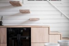 a minimalist under stairs kitchen
