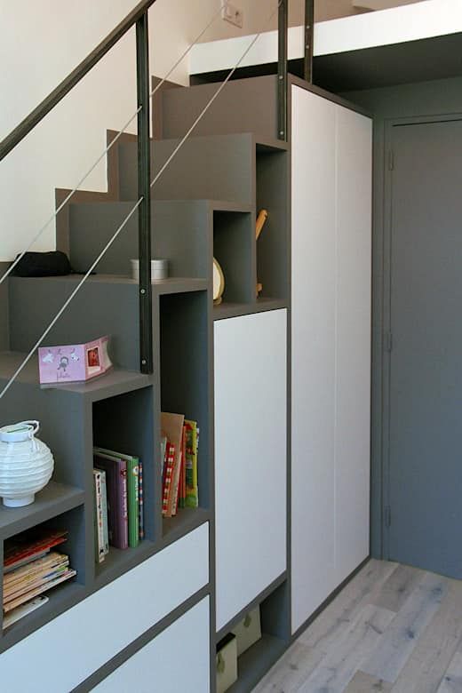 a modern grey and white staircase with open storage compartments and hidden ones is a cool and smart idea for a small home