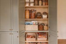 a pantry as a food storage unit, with shelves, jars and baskets, boxes with food is a cool solution for a kitchen
