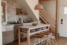 a cozy boho kitchen under stairs