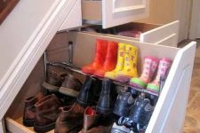 a staircase with built-in drawers for shoe storage is a cool idea for every home, hide away all the boots you arne’t wearing now