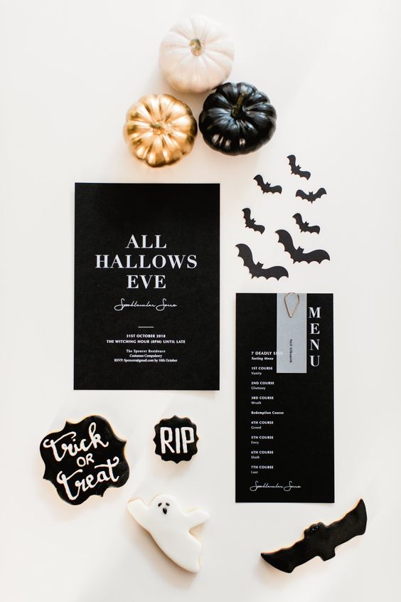 a stylish modern Halloween party invitation suite in black and white, with bats and creatively shaped cards