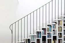 a white staircase that acts as a bookcase is all you need to save a lot of space in your home and show off your book collection