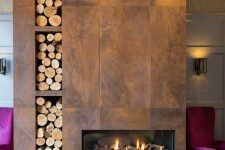 an aged metal clad fireplace with built-in niches for firewood is a bold solution for any space, it will bring a refined feel