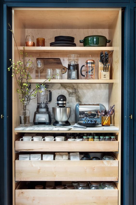 an organized built-in pantry with shelves, drawers, appliances, tableware and even some decor is a perfect idea