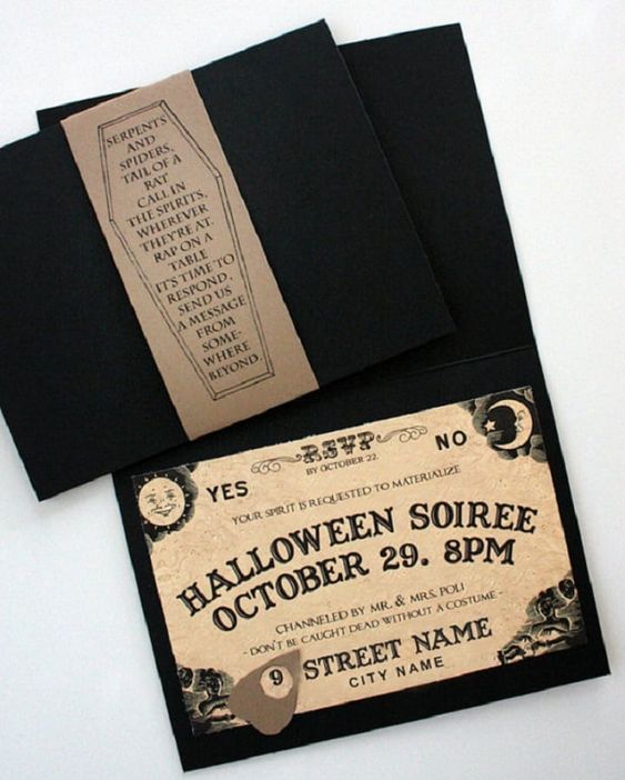an ouija board Halloween invitation in a black envelope with a coffin is a creative idea for a Halloween soiree