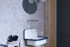 black and white dotted terrazzo and retro lamps and fixtures look unusual together