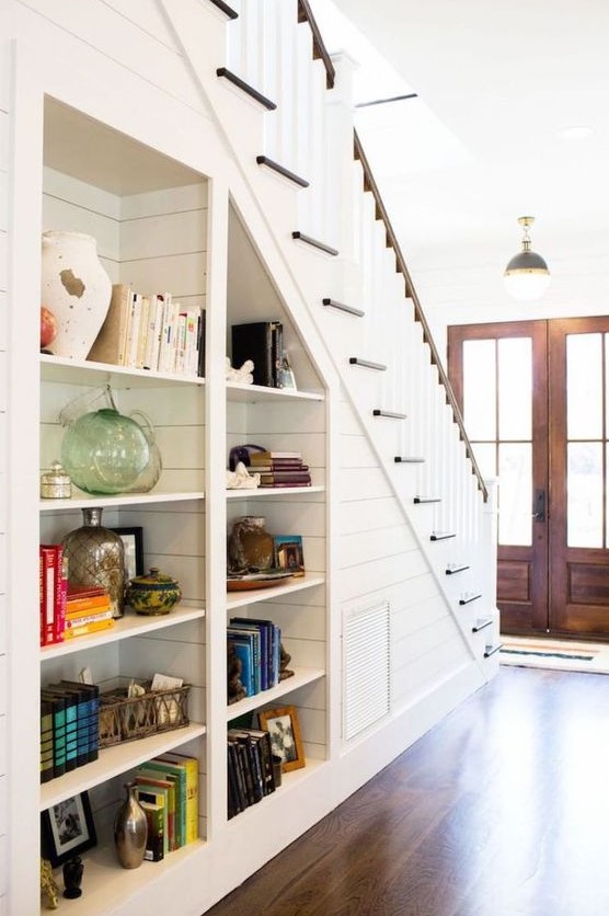 Built in open shelves under the stairs are nice to get more storage space without sacrificing floor space