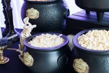 cauldrons used for displaying sweets are perfect for Harry Potter Halloween decor and parties