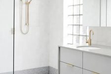 grey terrazzo floors and white walls for a peaceful yet modern to minimalist bathroom look