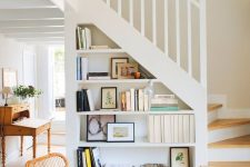 open built-in shelves in the staircase are a cool solution, they will save your space and make it cooler